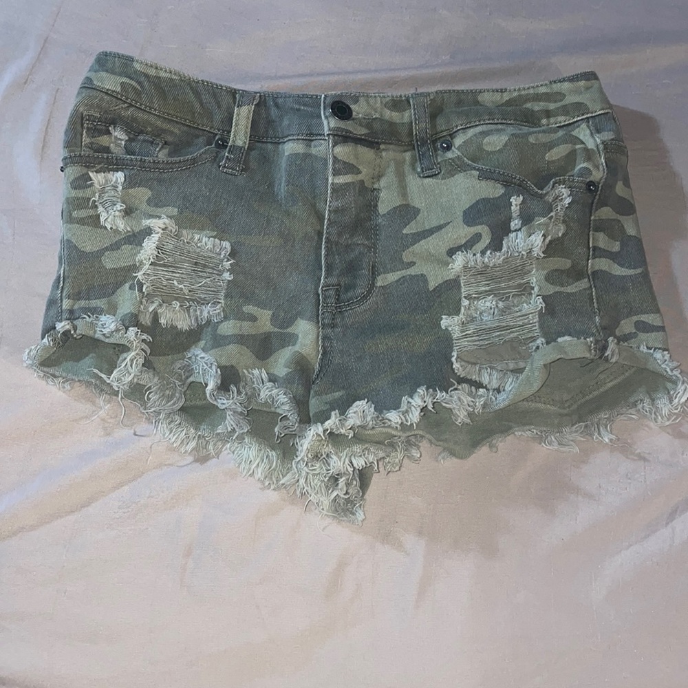 Green camouflage ripped shorts
